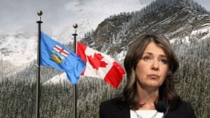 Danielle Smilth with Canada and Alberta's flag