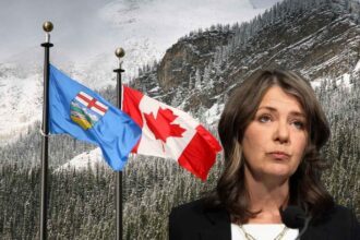 Danielle Smilth with Canada and Alberta's flag